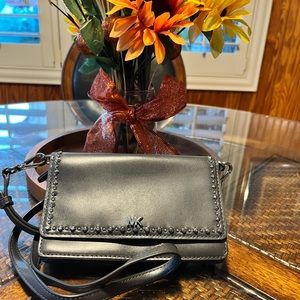 Michale Kors Dark grey wallet crossbody with cell phone pocket on the outside